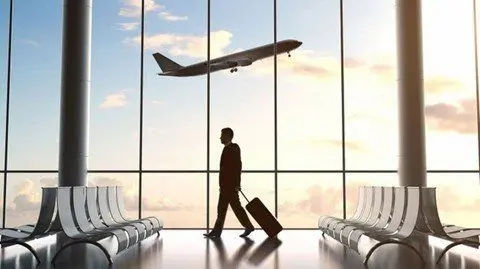 Traveler with luggage at the airport